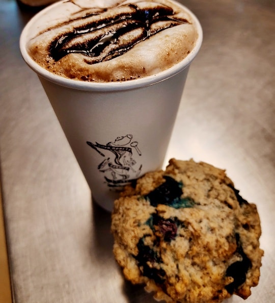 Pastries and coffee on table